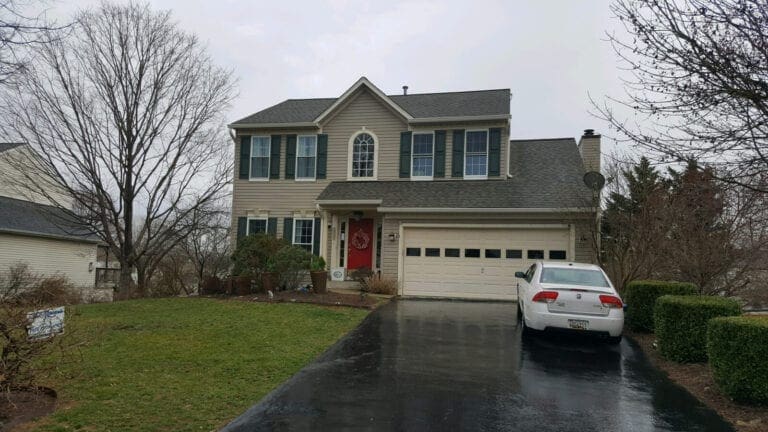 New gutters and guards on a two-story home in Silver Spring, MD