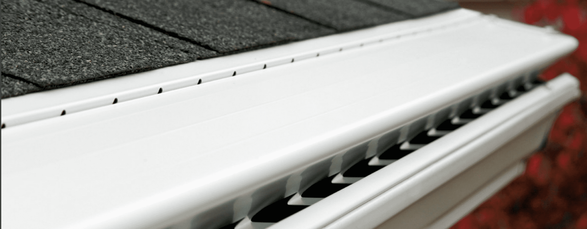 White Leaf Sentry hood cover curving over the front of a white gutter